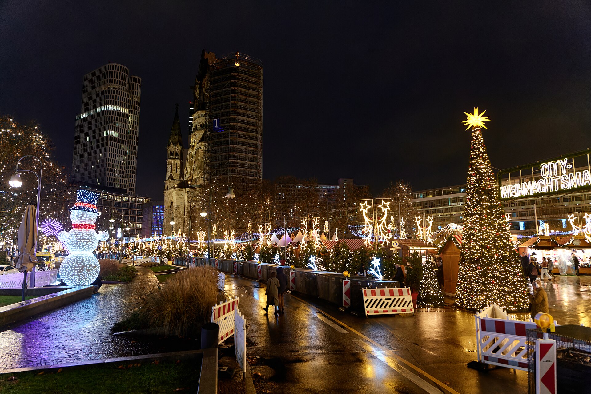 Christmas market lights at Breitscheidplatz beside Berlin’s Memorial Church
