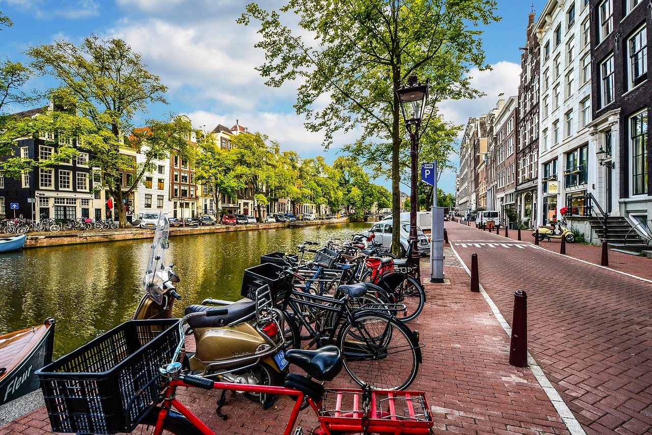 Bicycles locked to a canal bridge in Amsterdam